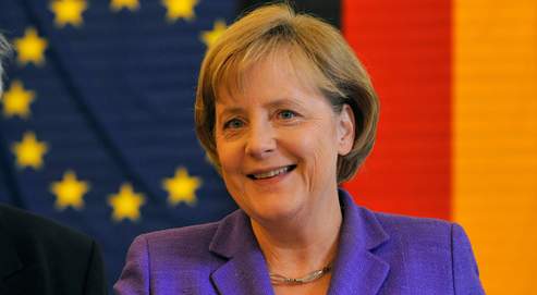 German Chancellor Angela Merkel casts her vote for the European Elections 2009 in a polling station in Berlin, Germany, Sunday June 7, 2009. (AP Photo/Gero Breloer)